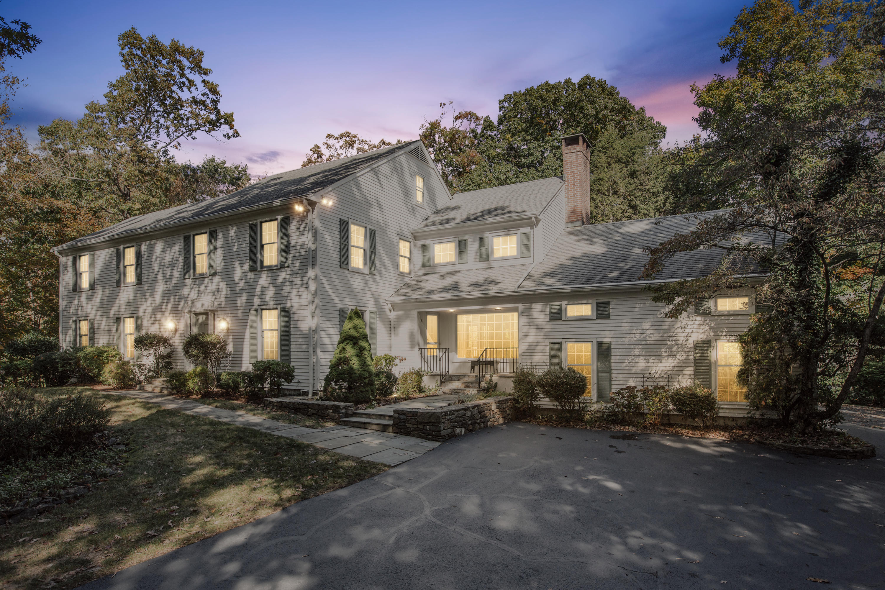 75 Delafield Island Road Darien, CT 06820 - Photo 26 of 28 a front view of a building with lots of green space