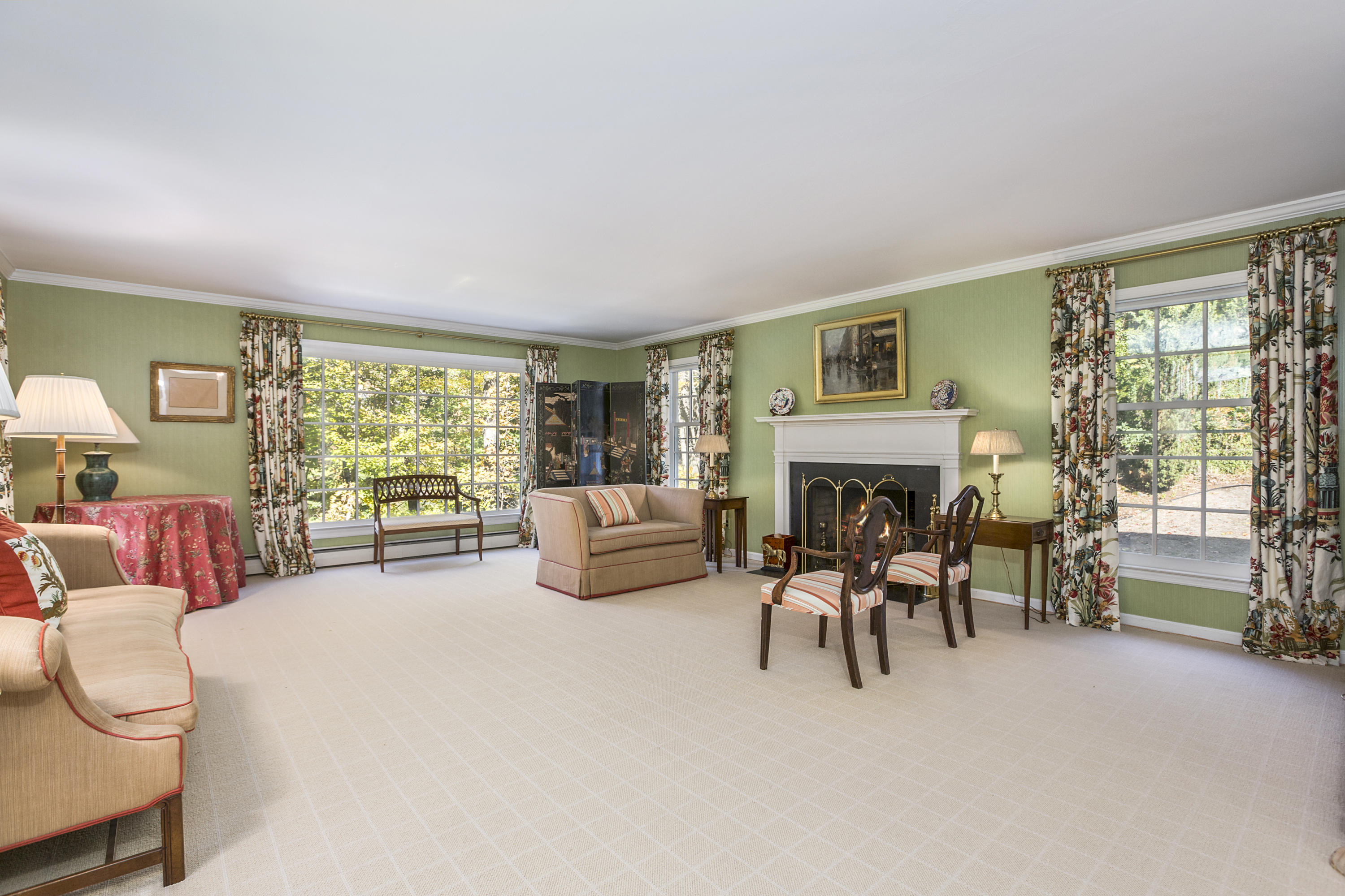 75 Delafield Island Road Darien, CT 06820 - Photo 4 of 28 a living room with furniture large fireplace and a large window
