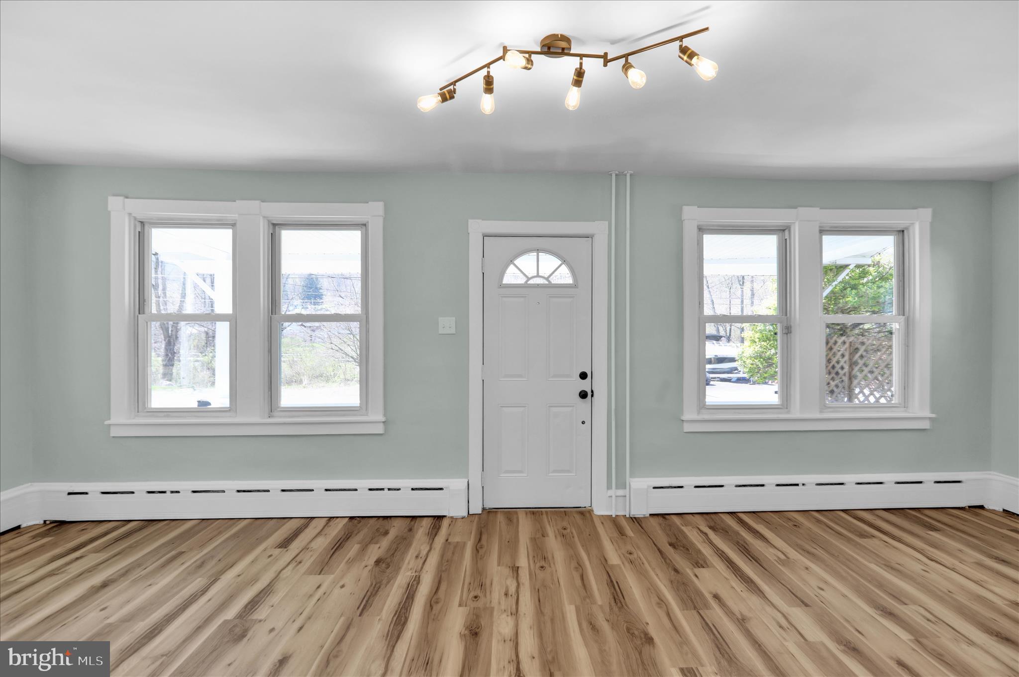 1425 Old River Road Birdsboro, PA 19508 - Photo 13 of 29 an empty room with wooden floor and windows