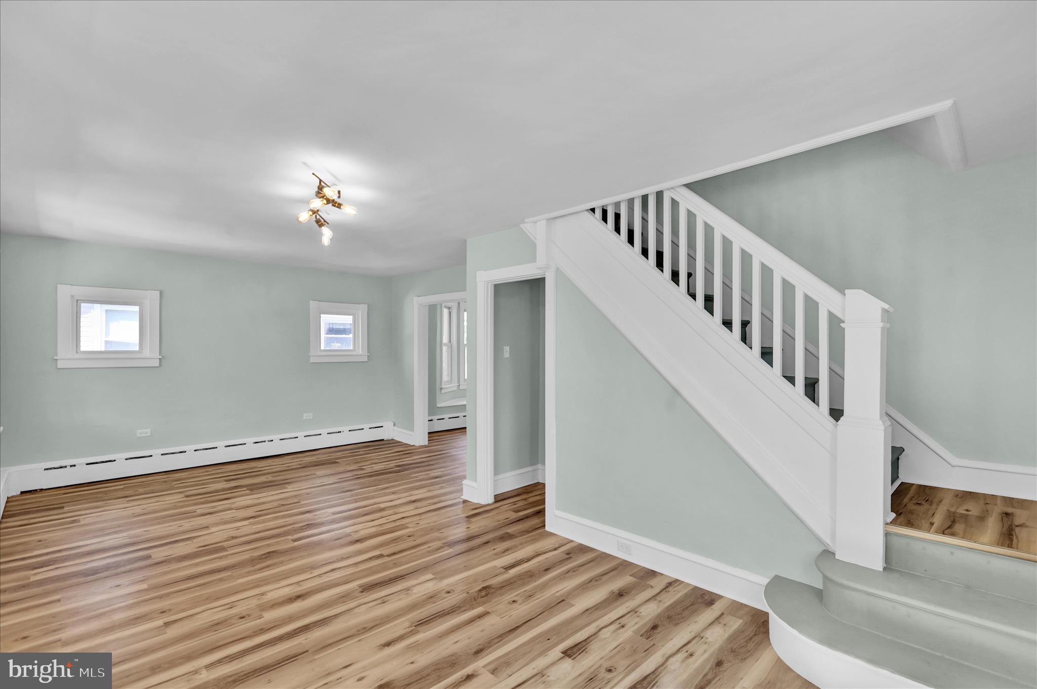 1425 Old River Road Birdsboro, PA 19508 - Photo 14 of 29 a view of an empty room with wooden floor stairs and a window