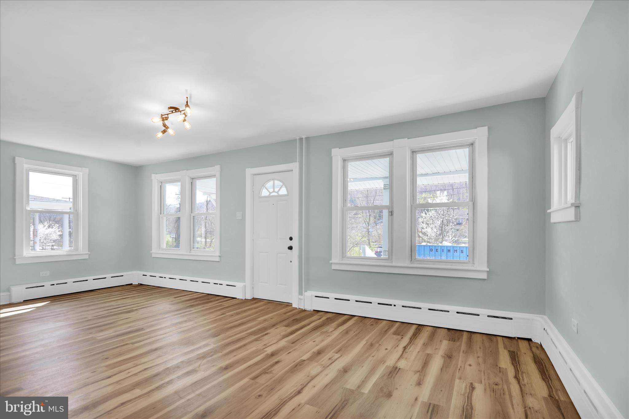 1425 Old River Road Birdsboro, PA 19508 - Photo 16 of 29 an empty room with wooden floor and windows