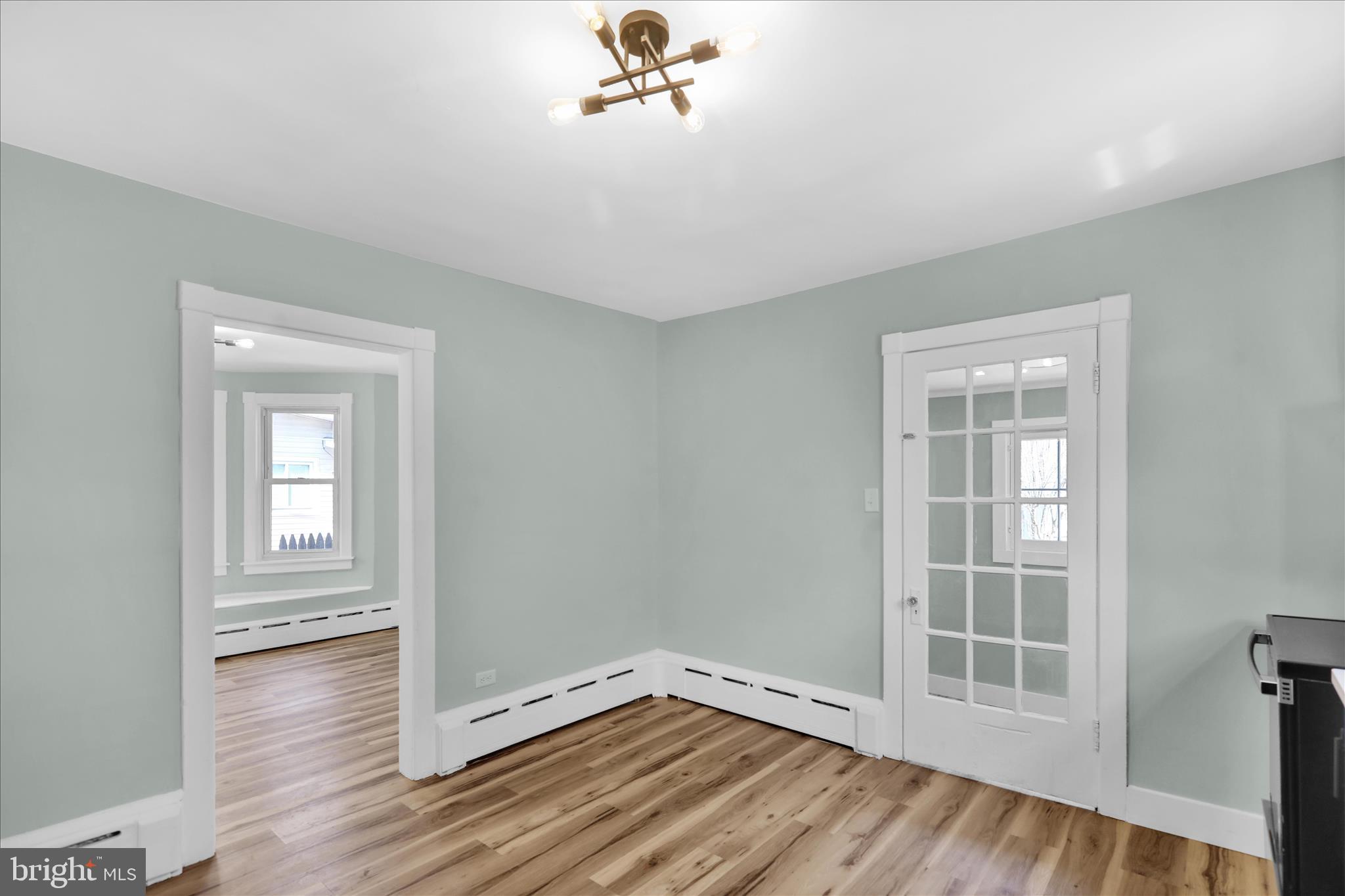 1425 Old River Road Birdsboro, PA 19508 - Photo 19 of 29 an empty room with wooden floor and windows