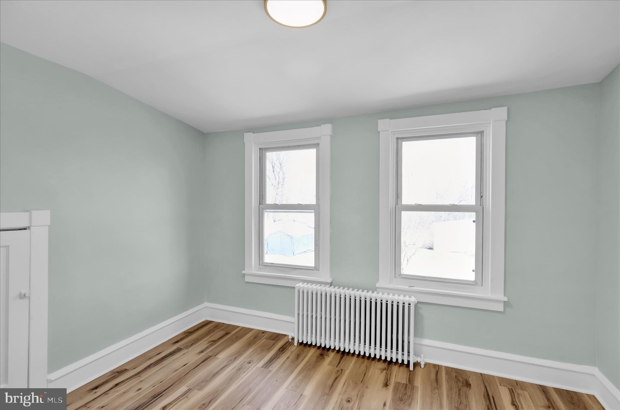 1425 Old River Road Birdsboro, PA 19508 - Photo 22 of 29 an empty room with wooden floor and windows