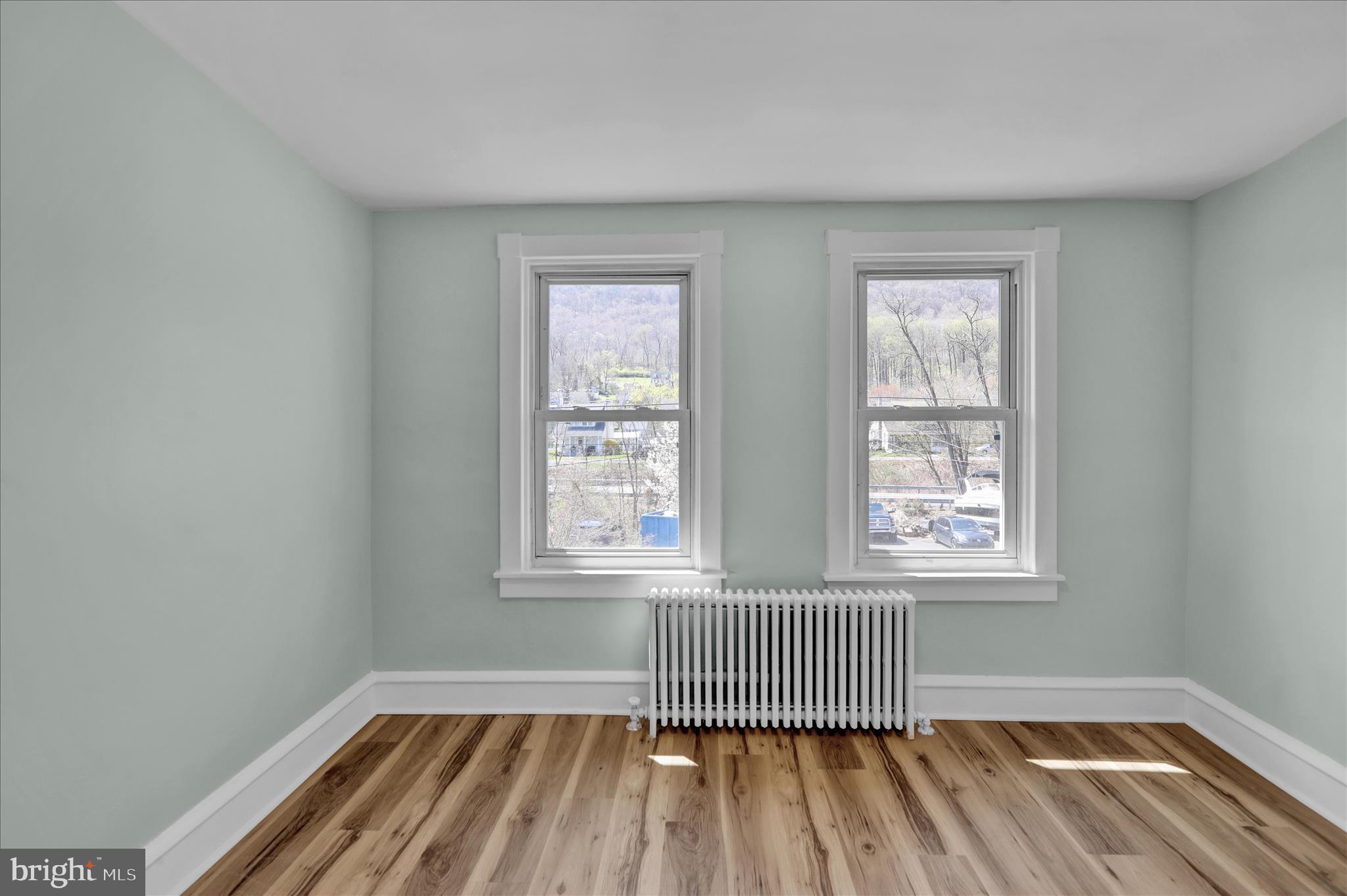 1425 Old River Road Birdsboro, PA 19508 - Photo 27 of 29 an empty room with wooden floor and windows