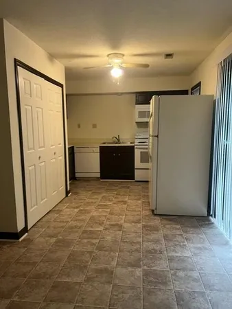 a large bathroom with a glass door shower