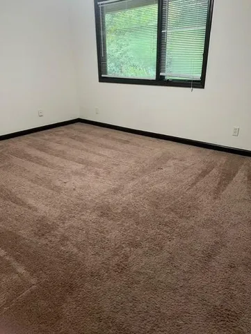 a view of a room that has a window in it