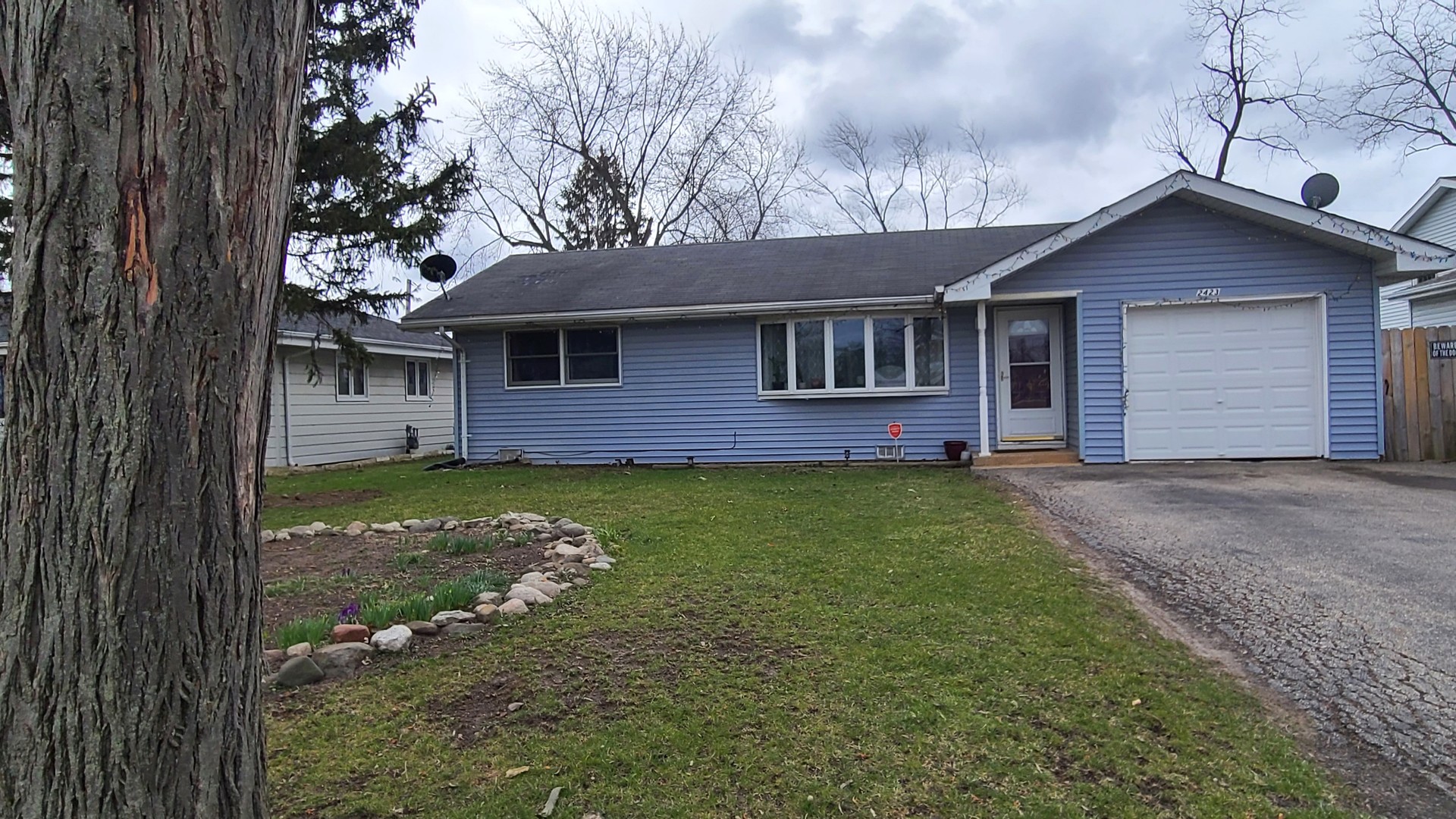 2423 Sand Lake Road Lindenhurst, IL 60046 - Photo 1 of 15 a front view of house with yard