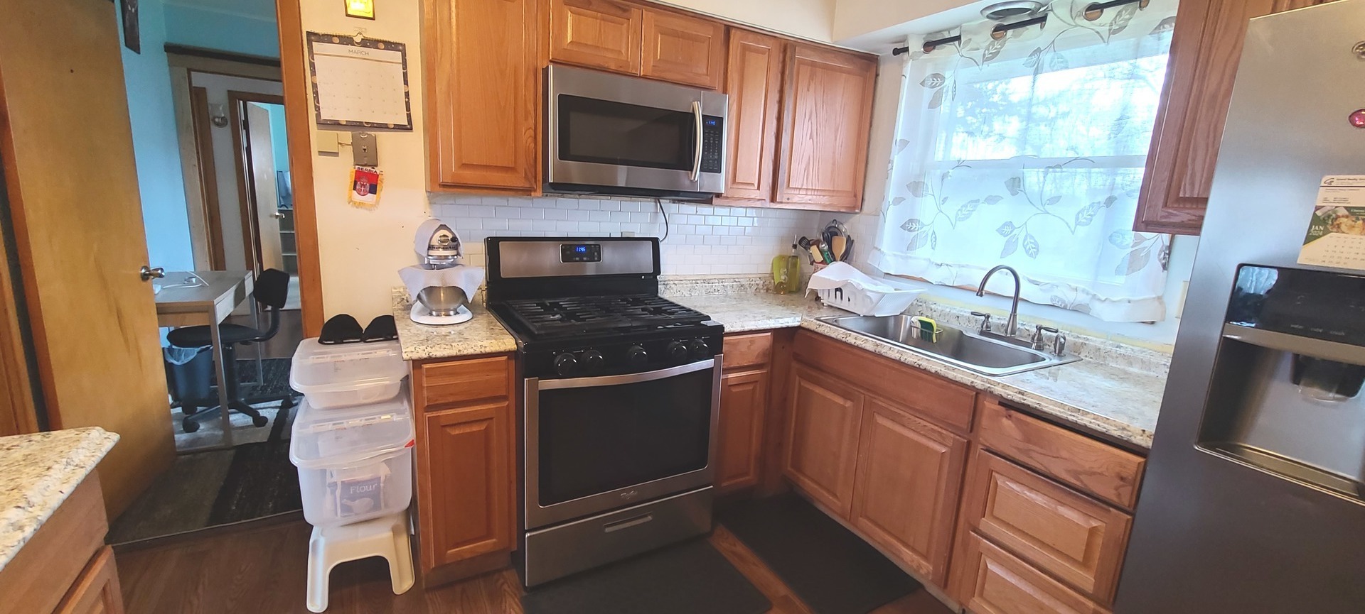 2423 Sand Lake Road Lindenhurst, IL 60046 - Photo 3 of 15 a kitchen with granite countertop a sink and a stove top oven