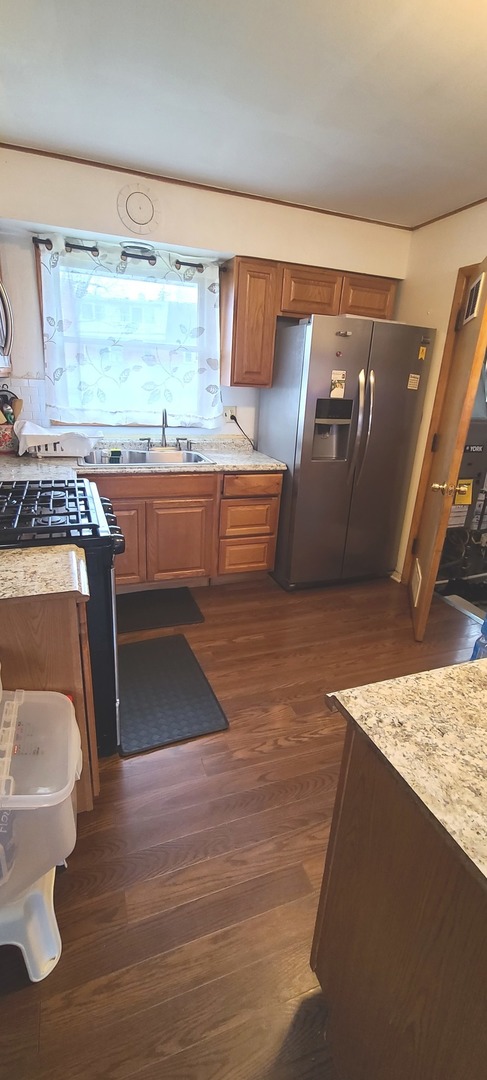 2423 Sand Lake Road Lindenhurst, IL 60046 - Photo 5 of 15 a view of a kitchen with a sink and a stove