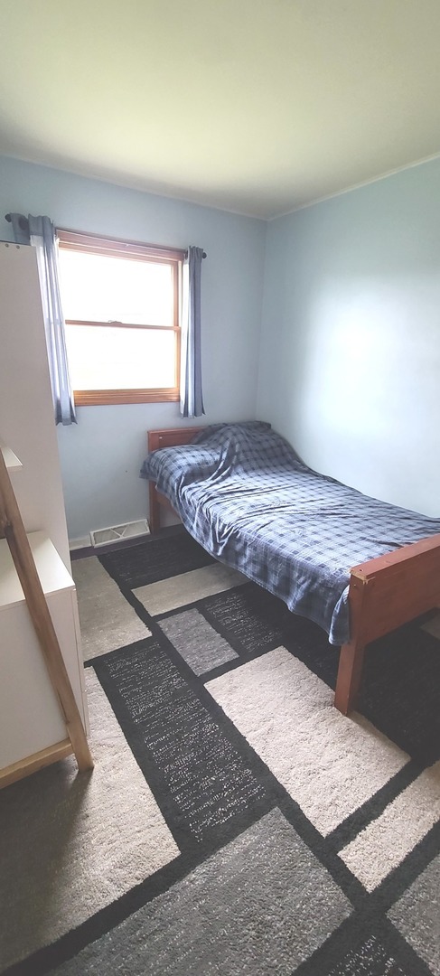 2423 Sand Lake Road Lindenhurst, IL 60046 - Photo 10 of 15 a view of a big room with wooden floor