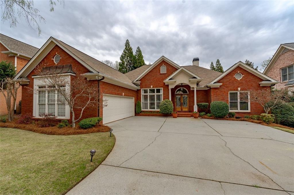6961 Brandon Mill Road Northwest Sandy Springs, GA 30328 - Photo 1 of 1 front view of a house with yard