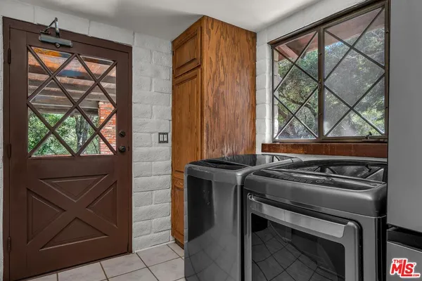 a bathroom with a sink and a window