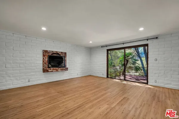 a view of a room that has a door in it