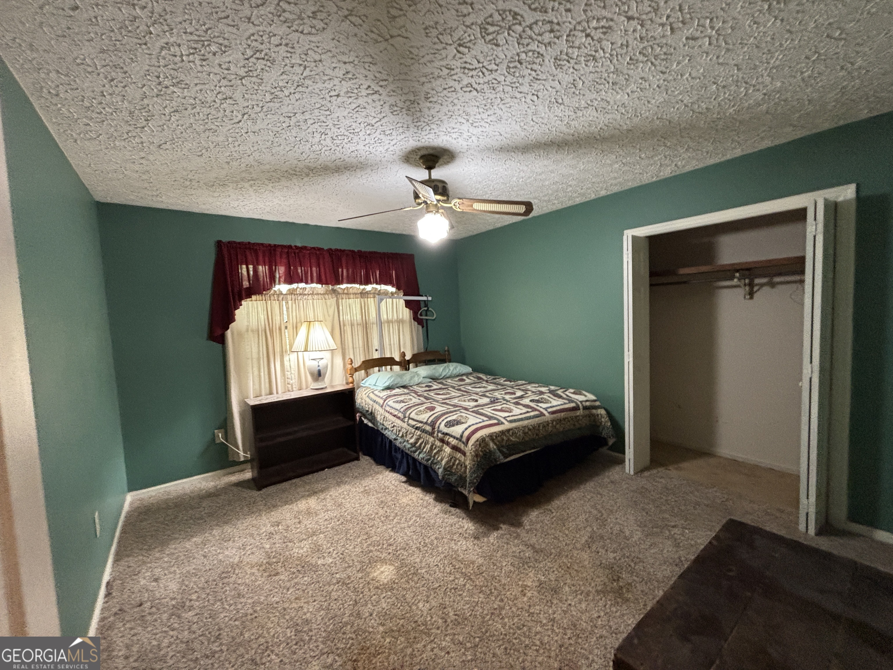 173 Berkley Road Cochran, GA 31014 - Photo 43 of 88 a bedroom with a bed and a window