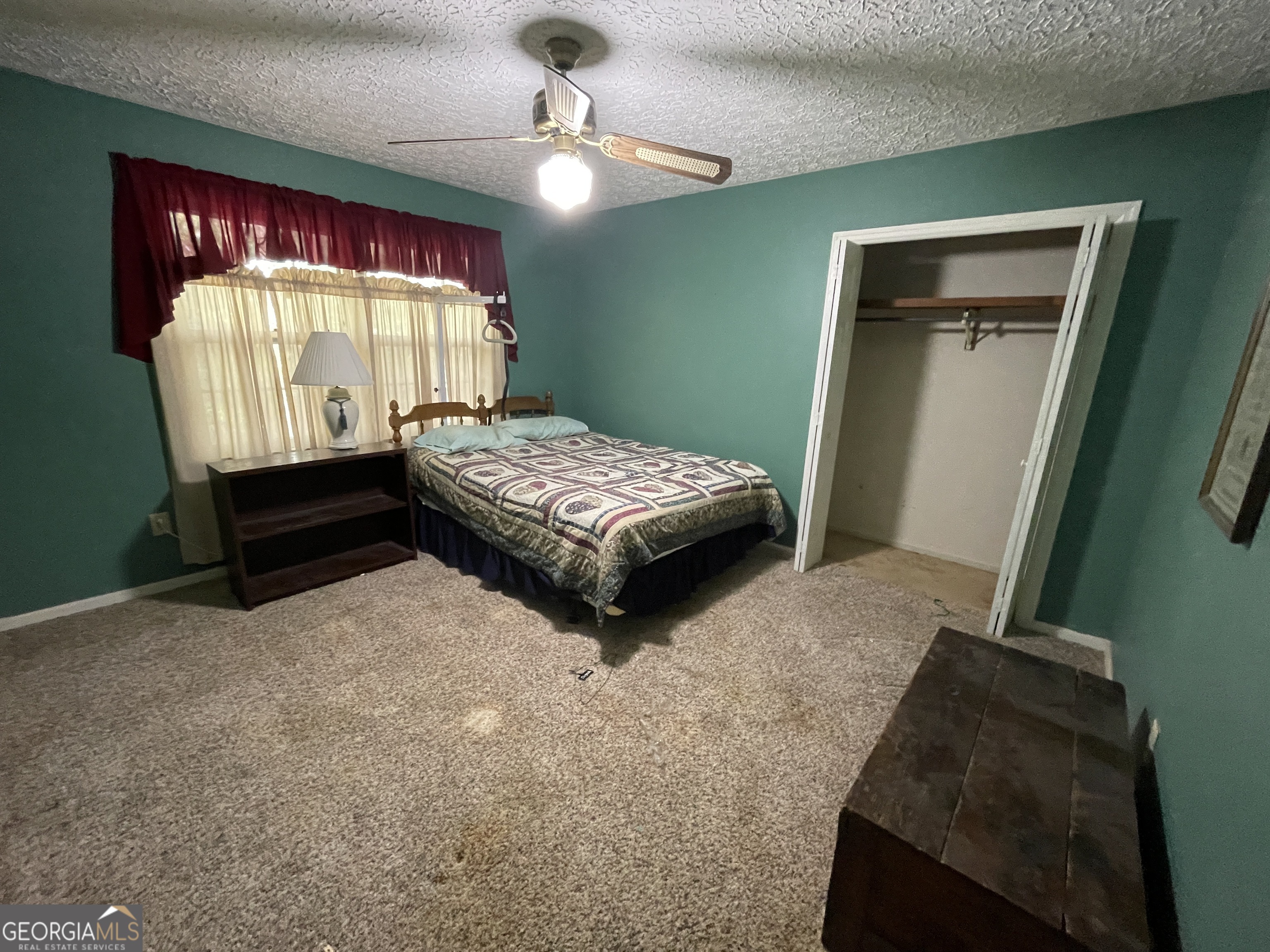173 Berkley Road Cochran, GA 31014 - Photo 44 of 88 a bedroom with a bed and window