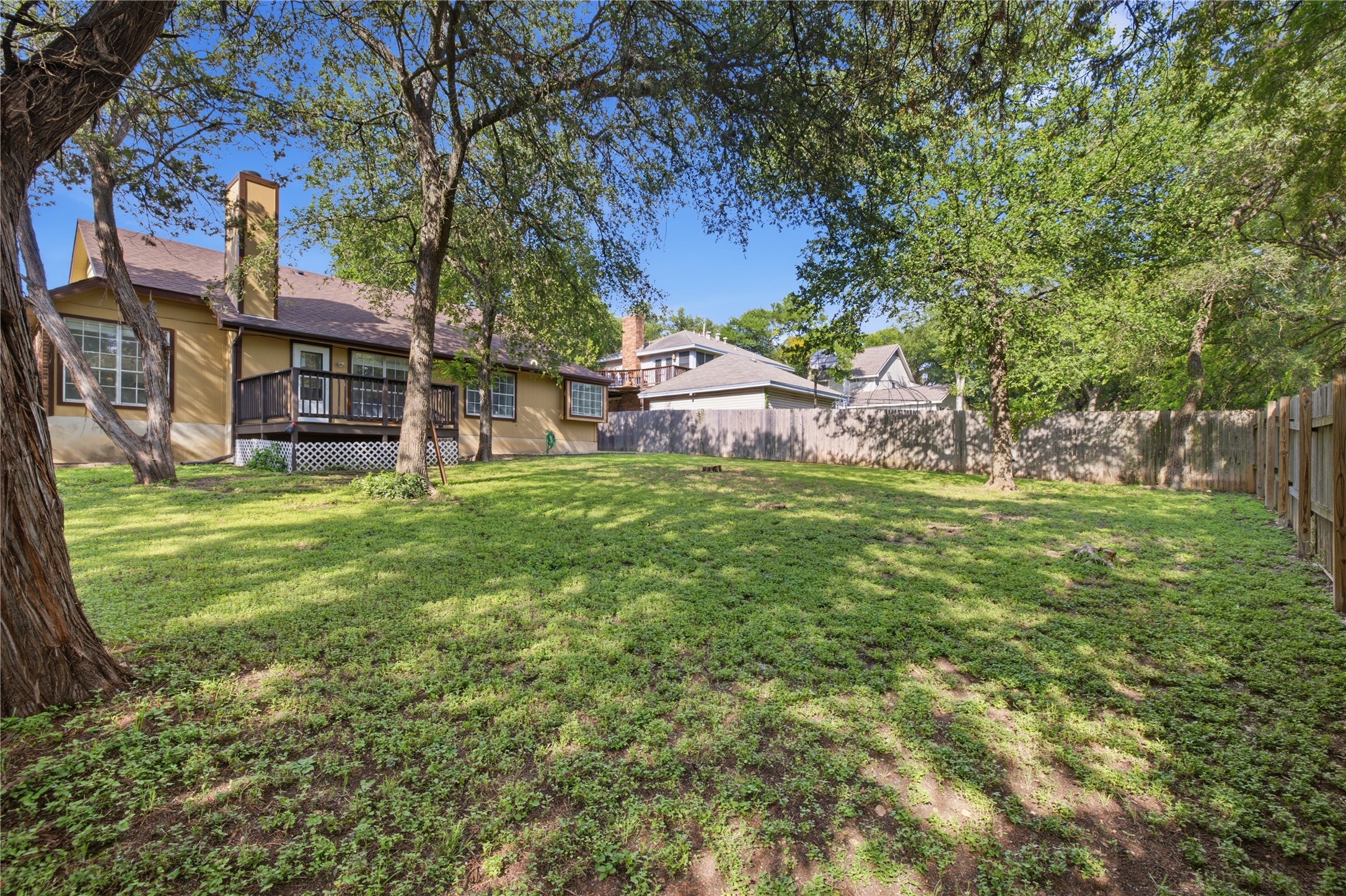 2922 Wickersham Lane Austin, TX 78741 - Photo 14 of 26 a backyard of a house with table and chairs