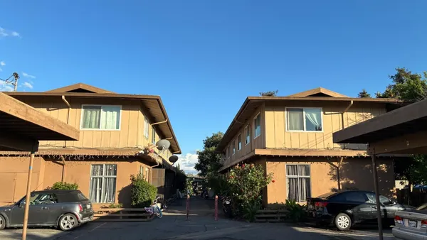 a front view of a house with a street