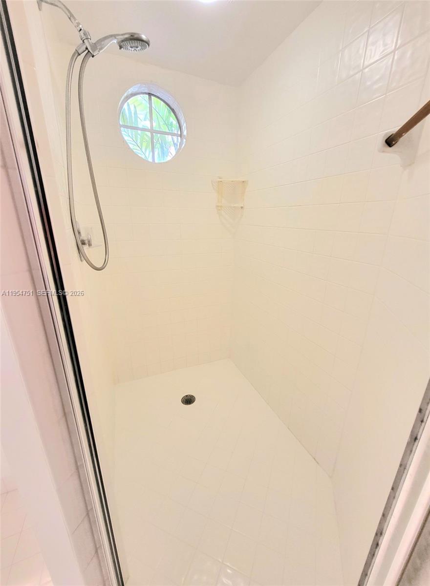 17286 Boca Club Boulevard, Unit 2108 Boca Raton, FL 33487 - Photo 14 of 25 a bathroom with a shower