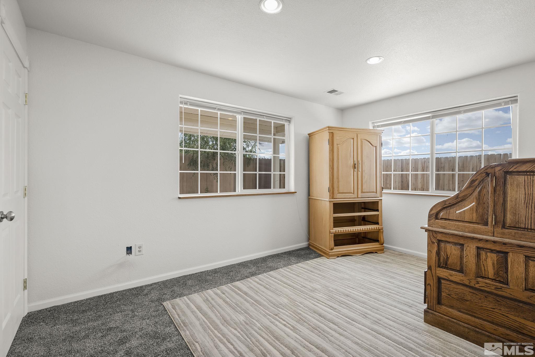3300 Alcorn Road Fallon, NV 89406 - Photo 16 of 40 a bedroom with furniture and wooden floor