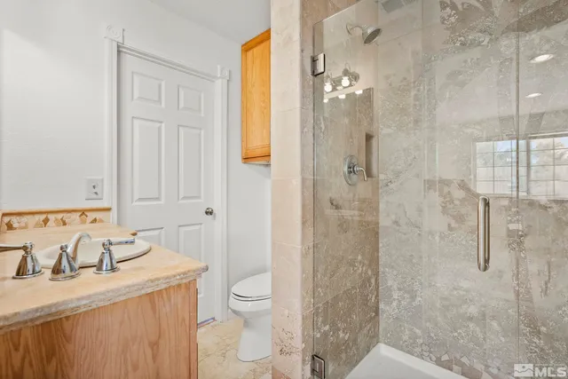 a front view of a house with a yard and a garage