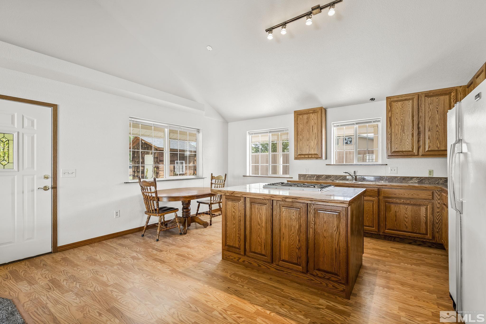 3300 Alcorn Road Fallon, NV 89406 - Photo 8 of 40 a large kitchen with a table and chairs in it