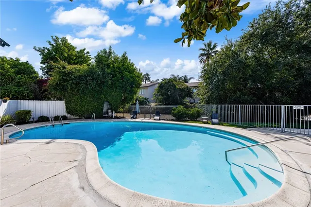 a view of a swimming pool with a patio
