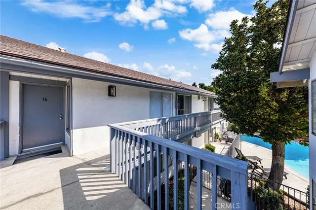 a side view of house with deck and outdoor seating