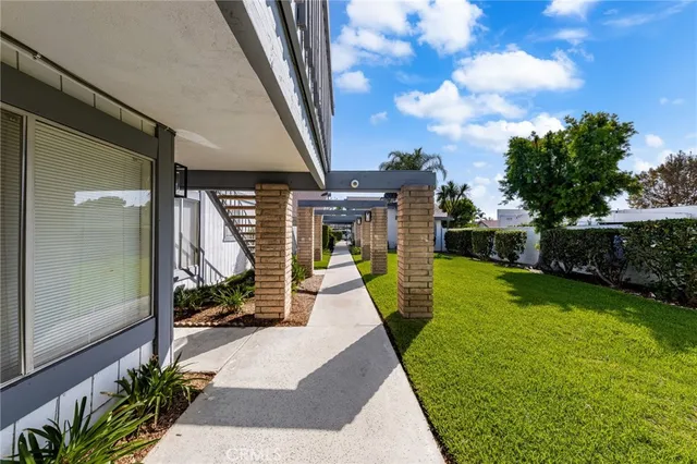a view of a backyard with sitting area