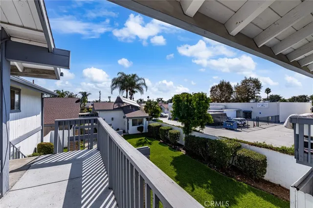 a terrace with outdoor seating and city view