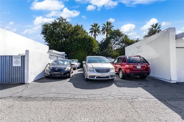 a view of a car parked in back of a garage