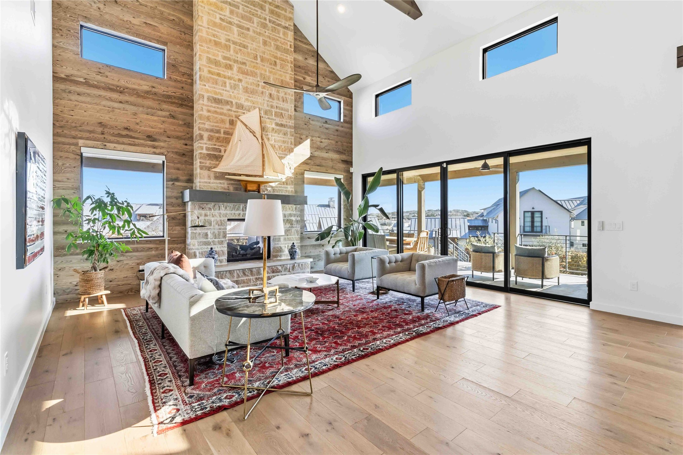 410 Kayak Way Austin, TX 78738 - Photo 5 of 39 a living room with fireplace furniture and a large window