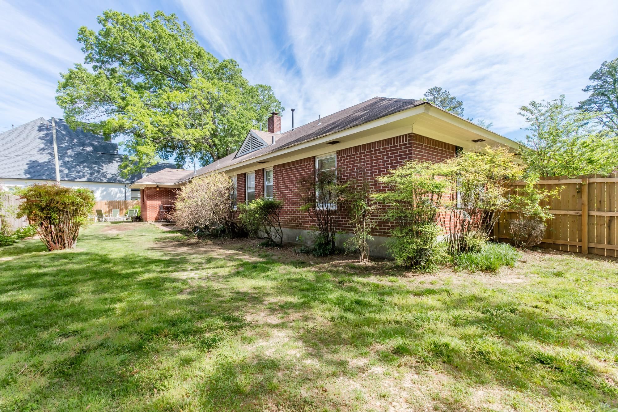 4722 Sequoia Road Memphis, TN 38117 - Photo 22 of 23 a backyard of a house with plants and outdoor seating