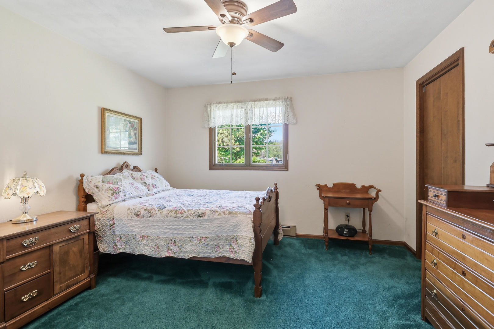 2660 252nd Street De Witt, IA 52742 - Photo 25 of 45 a bedroom with a bed and a lounge chair