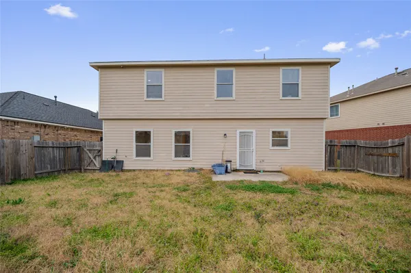 a view of a house with a yard and a yard