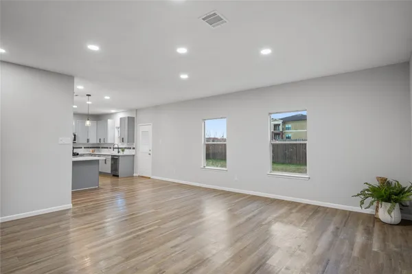 a view of kitchen with window and wooden floor