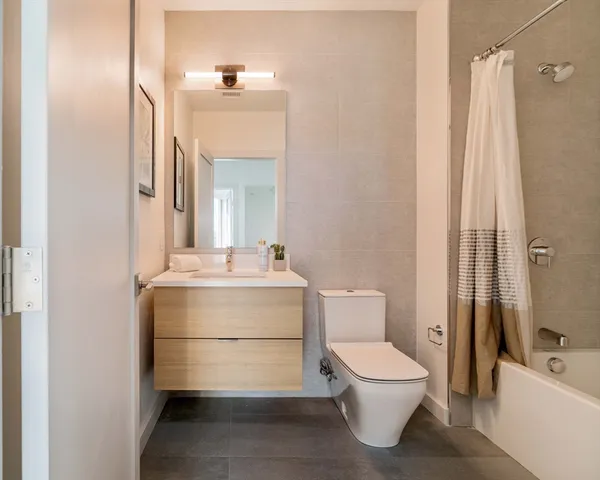 a bathroom with a toilet a sink and a bathtub