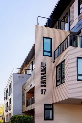 a front view of residential houses with stairs