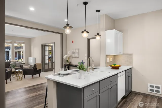 a bedroom with a bed and a lamp