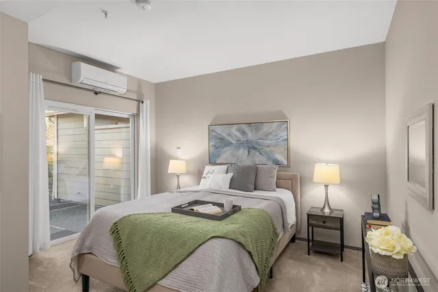 a bathroom with a shower and a glass door