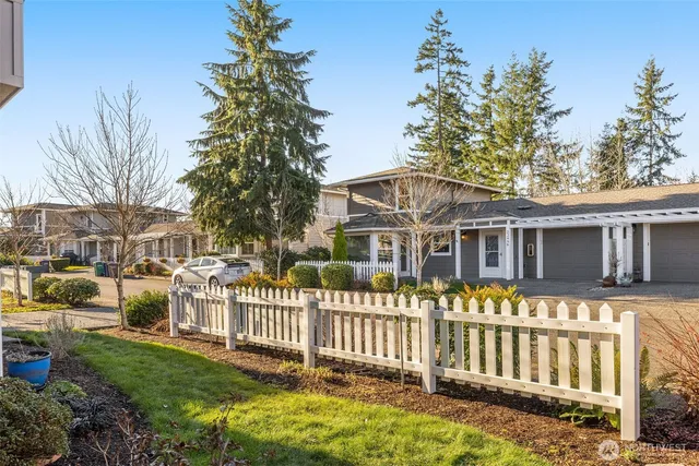 a front view of a house with outdoor seating
