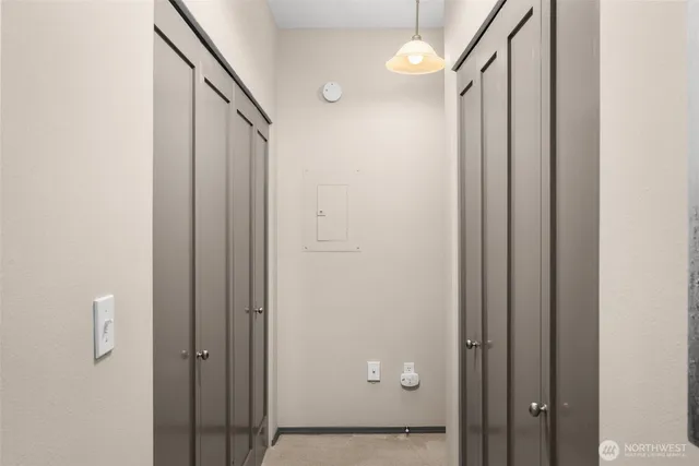 a view of a livingroom with furniture and a bookshelf