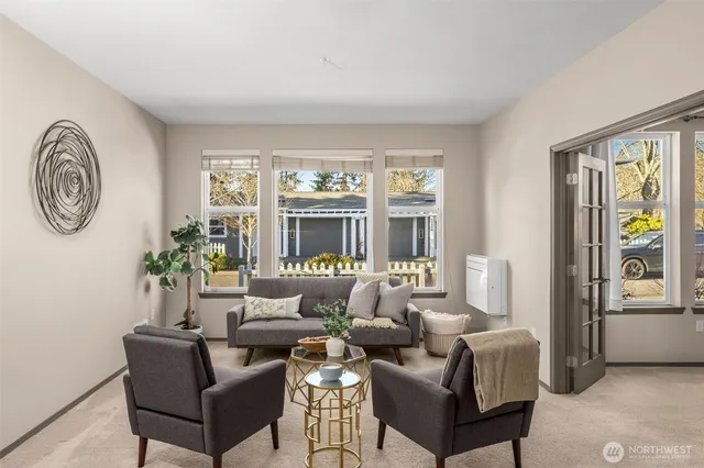 a living room with furniture and a window