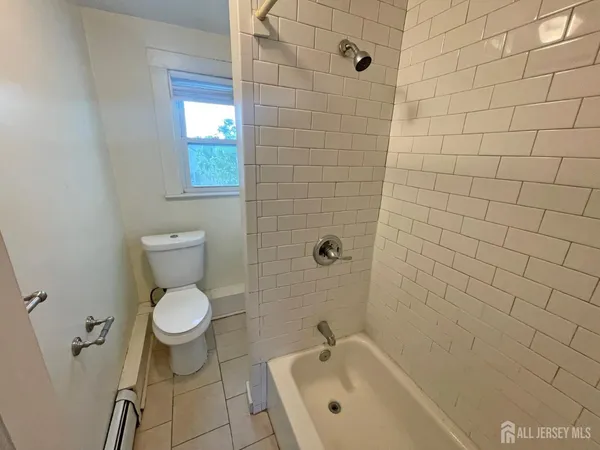 an empty room with a mirror