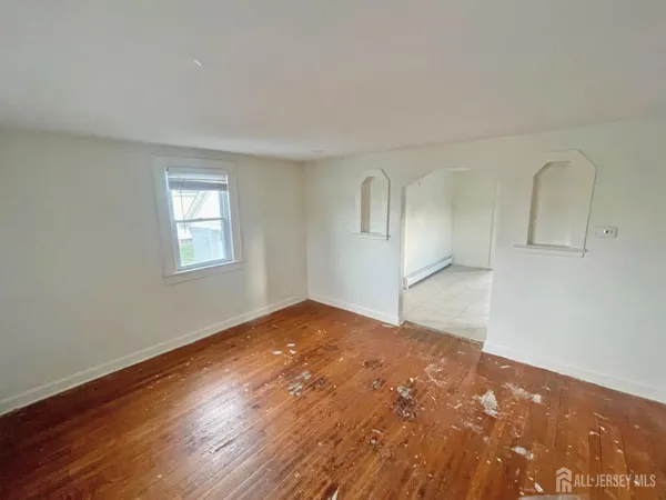 a view of an empty room and a mirror