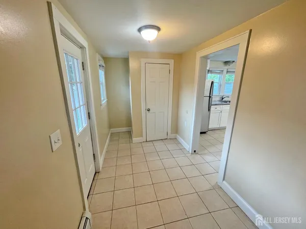 a view of hallway with window and stairs