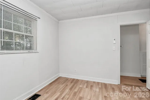 a view of a room that has a window in it