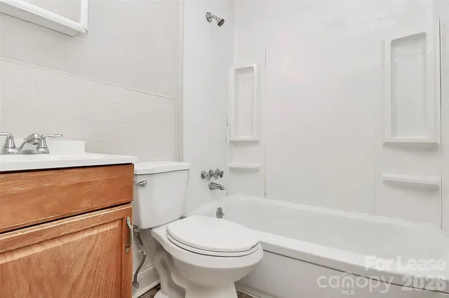 a bathroom with a sink toilet and bathtub
