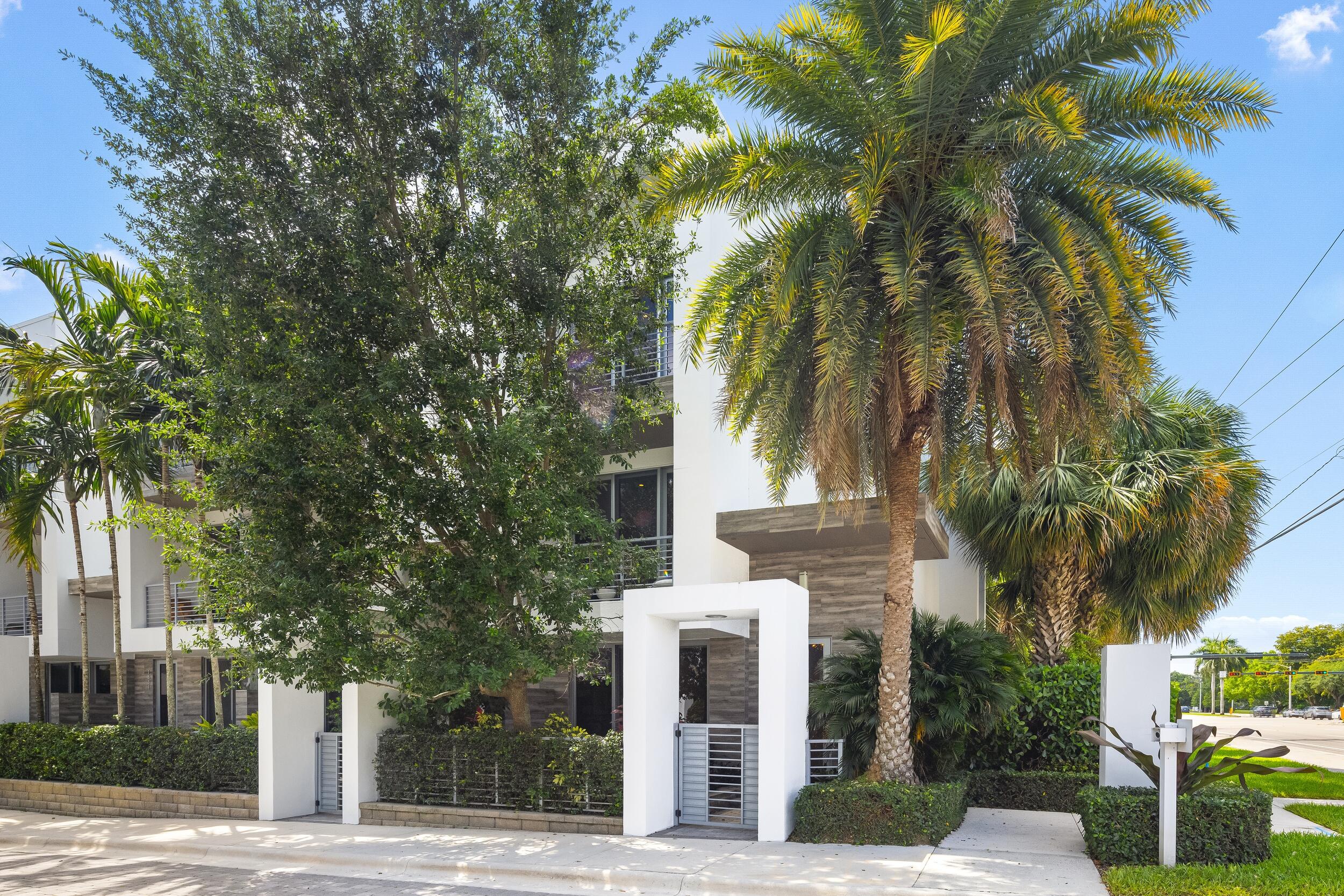 1851 Northwest 40th Drive Boca Raton, FL 33431 - Photo 1 of 42 a view of a street with palm trees