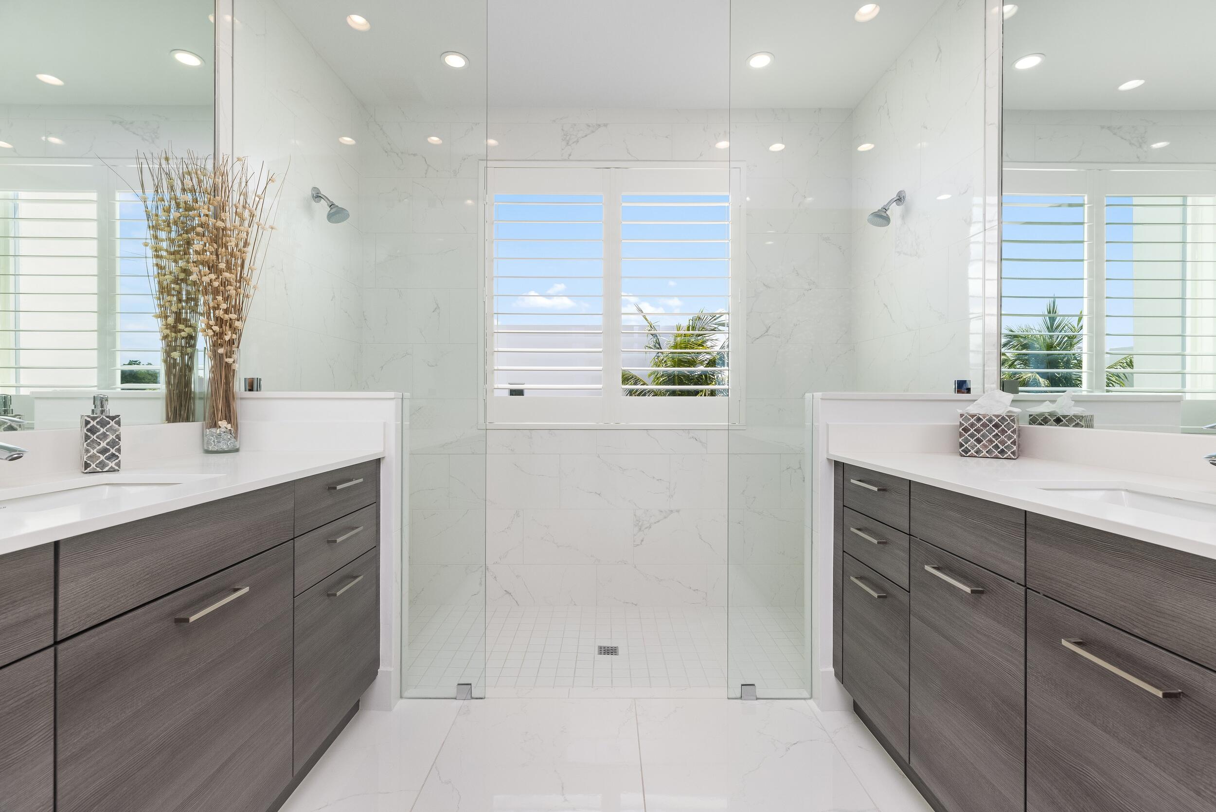 1851 Northwest 40th Drive Boca Raton, FL 33431 - Photo 11 of 42 a bathroom with a sink double vanity and a mirror