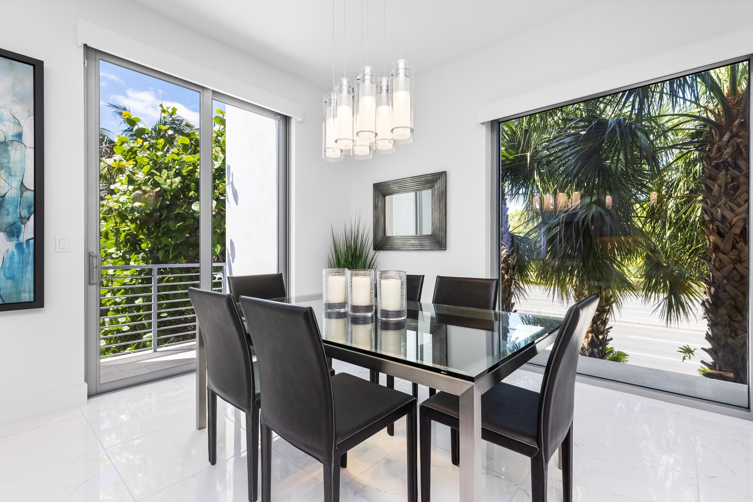 1851 Northwest 40th Drive Boca Raton, FL 33431 - Photo 20 of 42 a view of a dining room with furniture window and outside view